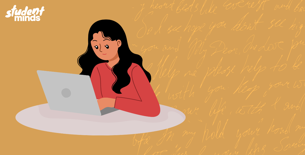 person next to a laptop